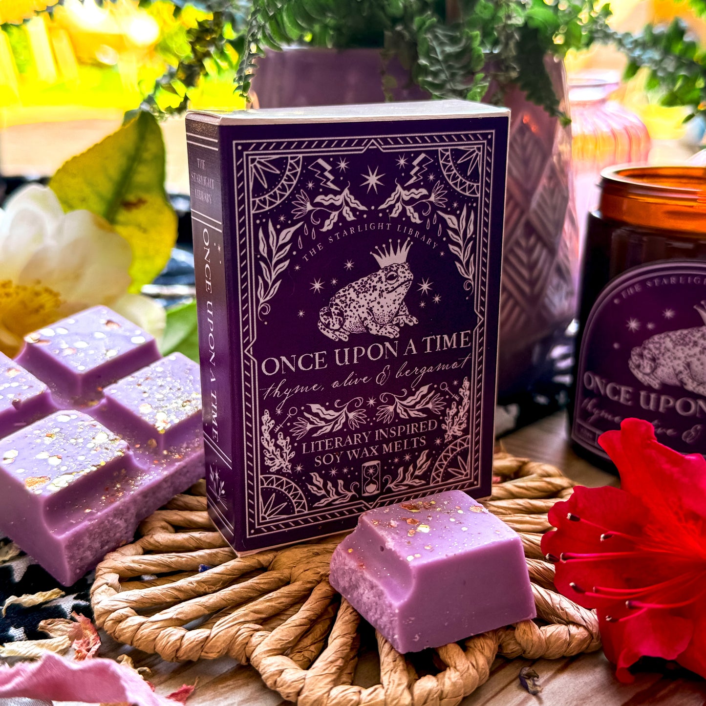 Once Upon A Time Literary Wax Melts with a broken up wax melt bar alongside.