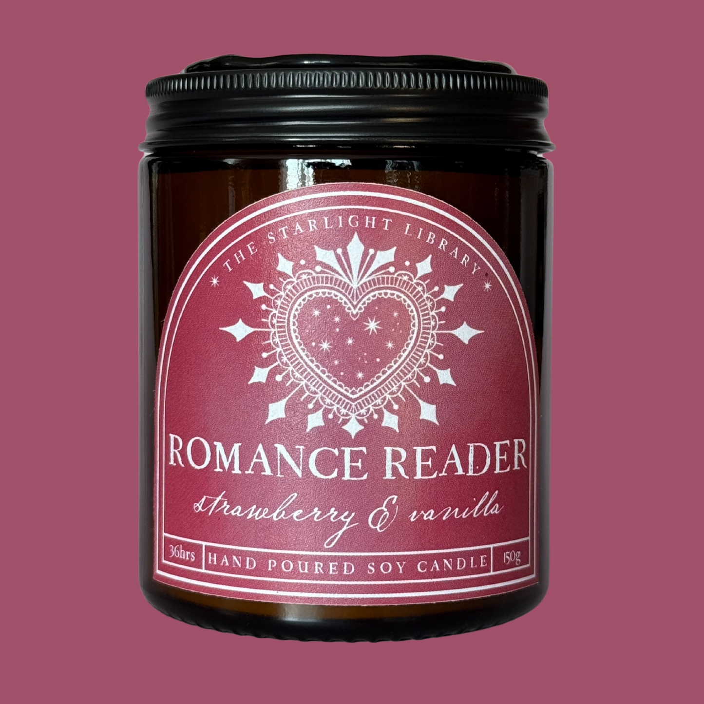 A Romance Reader candle against a matching pink studio background