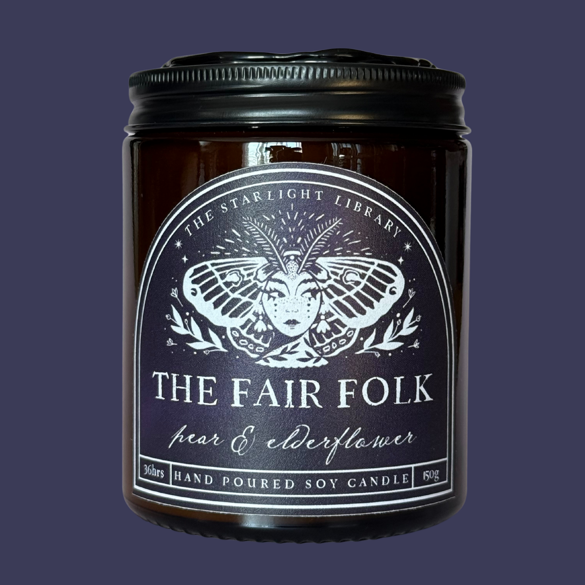 A Fair Folk candle against a matching dark blue studio background
