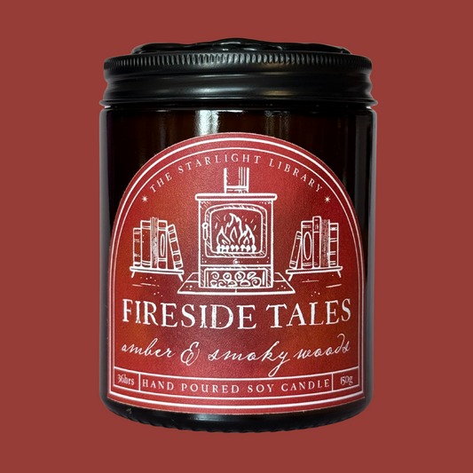 Fireside Tales candle against a matchng red studio background.