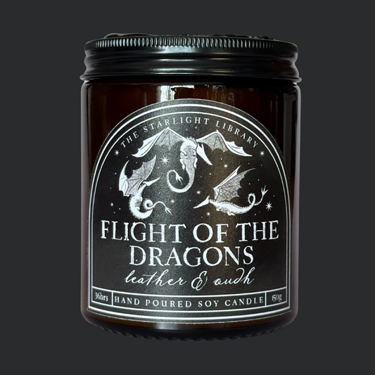 A Flight of the Dragons candle agaisnt a matching charcoal studio background.