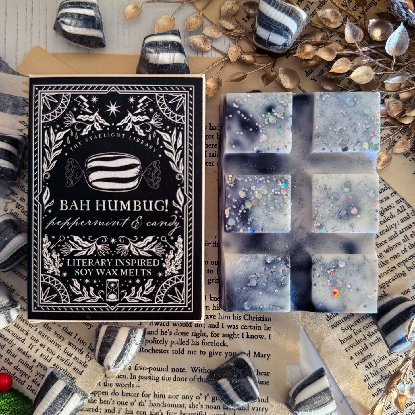 Box of Bah Humbug peppermint and candy soy wax melts with packaging details on a textured surface.