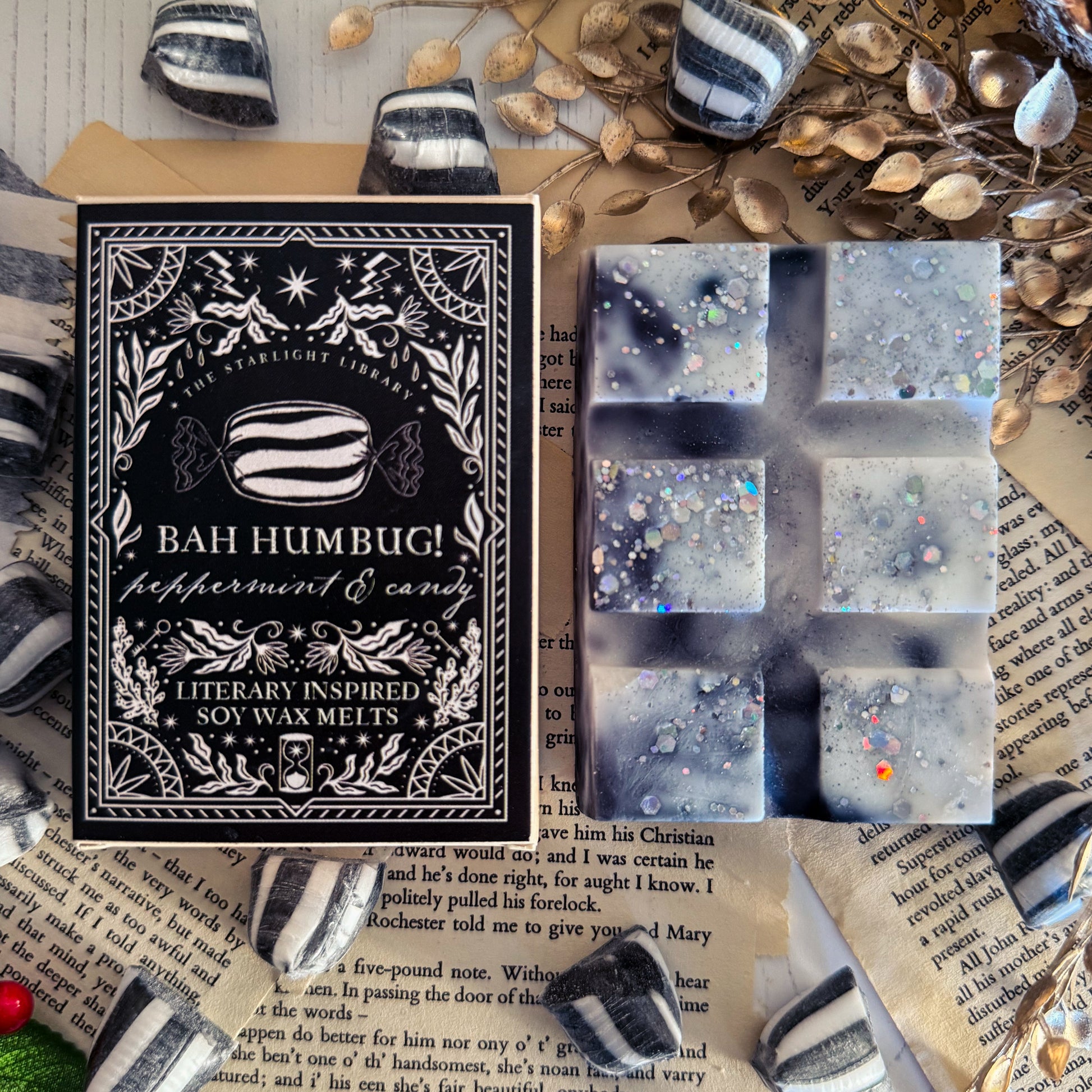Box of Bah Humbug peppermint and candy soy wax melts with packaging details on a textured surface.