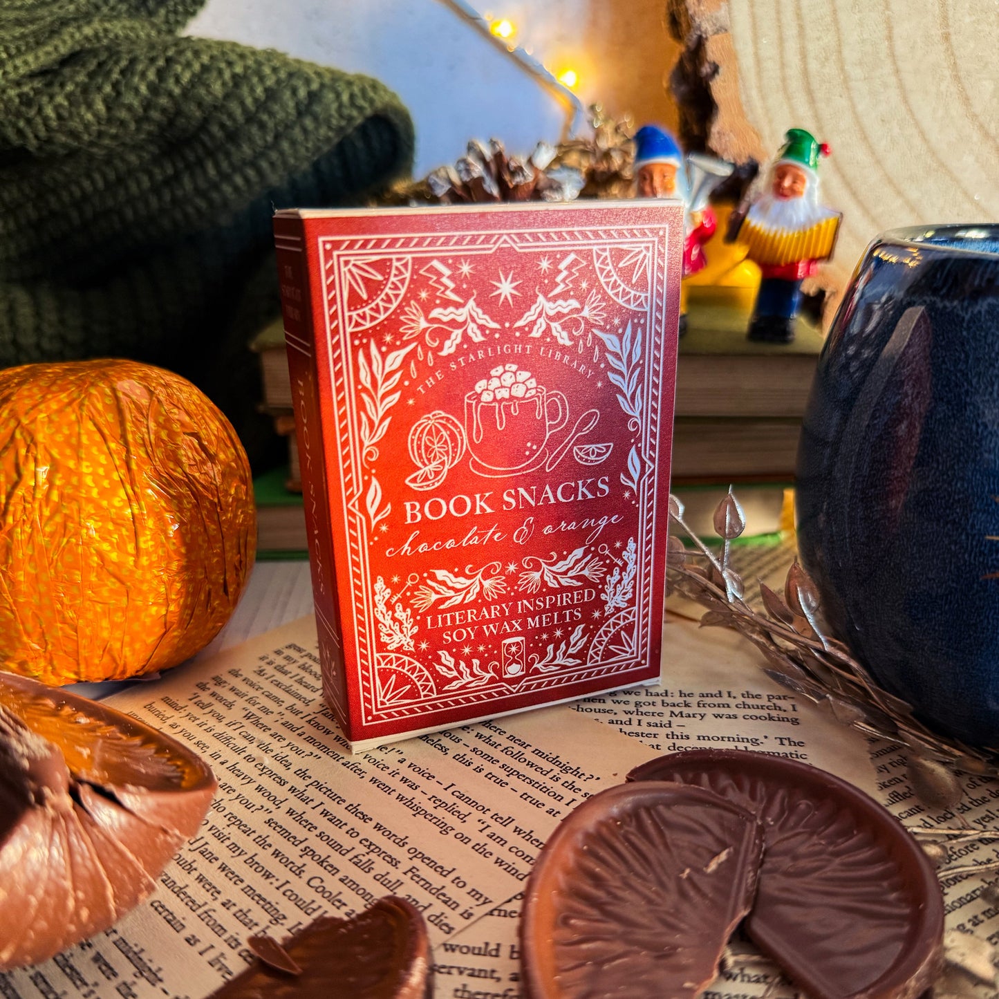Red box labeled 'Book Snacks' with chocolate slices on a surface with text