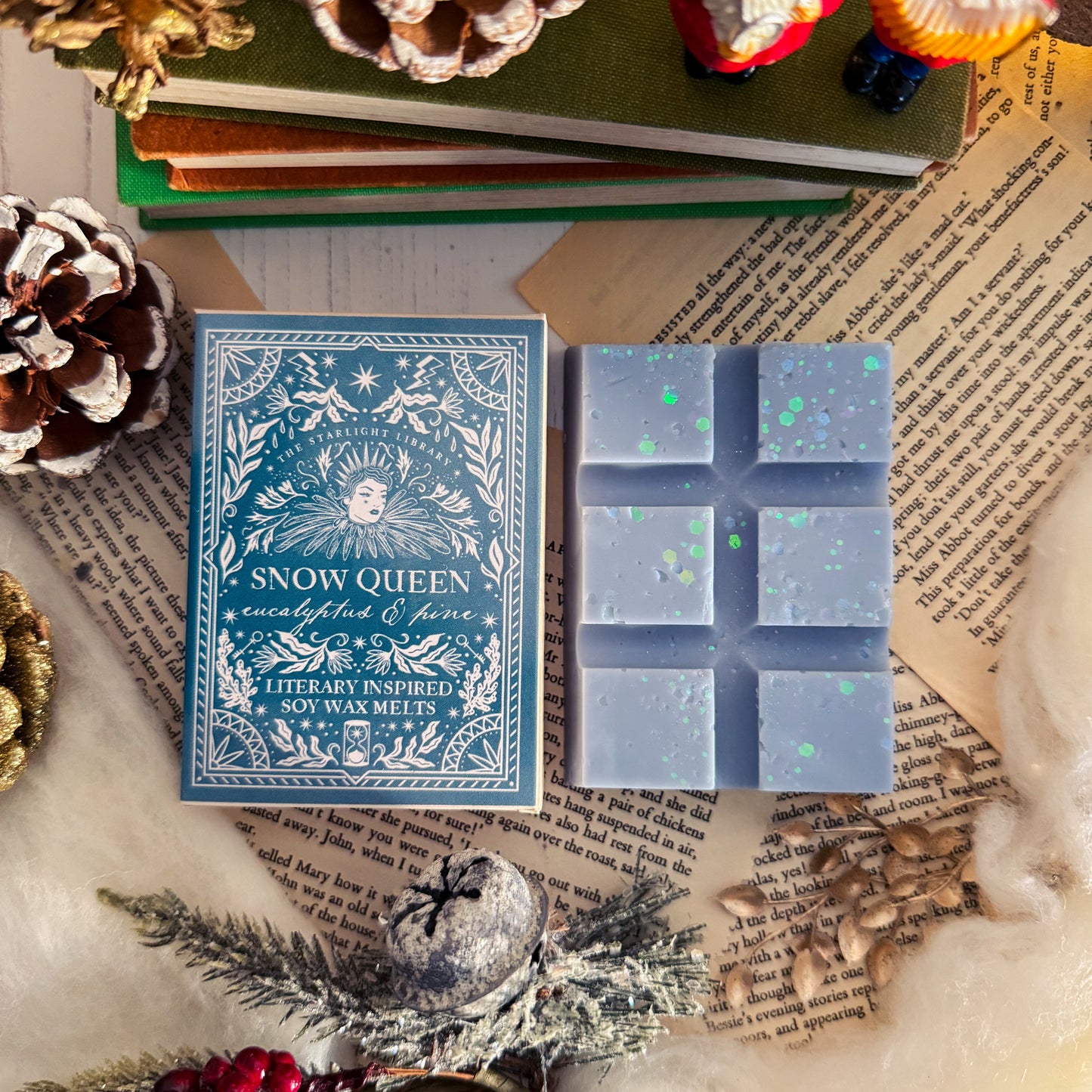 Snow Queen wax melts packaging with decorative elements on a textured surface