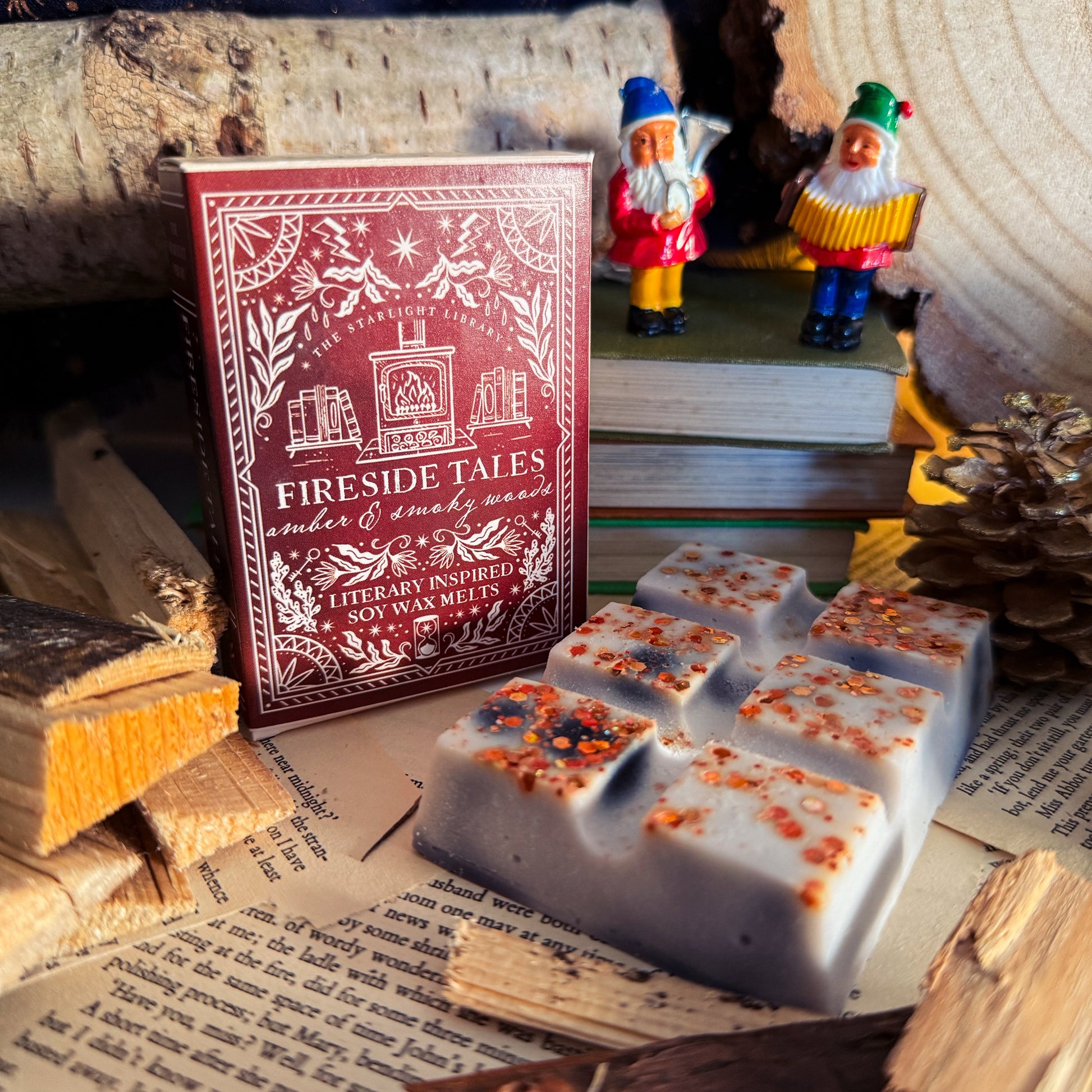Wax melts with decorative packaging labeled 'Fireside Tales' on a rustic background with books and small figurines.