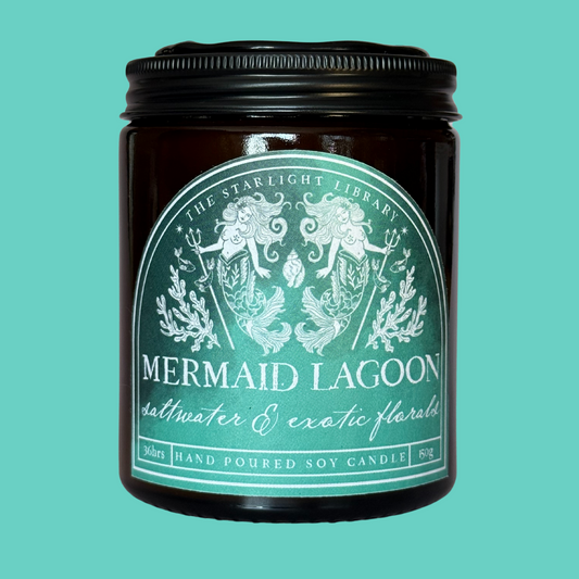 A Mermaid Lagoon candle against a matching turquoise studio background