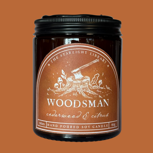 A Woodsman candle against a matching studio background